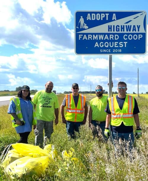 farmward cooperative team members cleaning road ditches