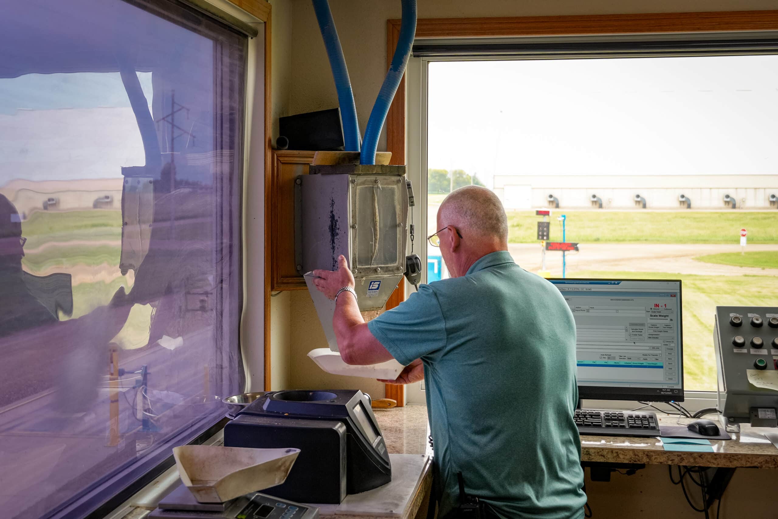 framward employee in feed controller room