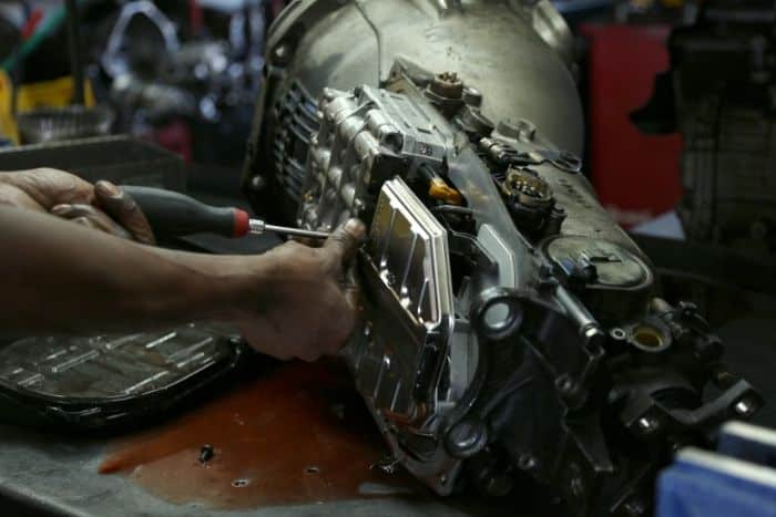 Mechanic working on transmission