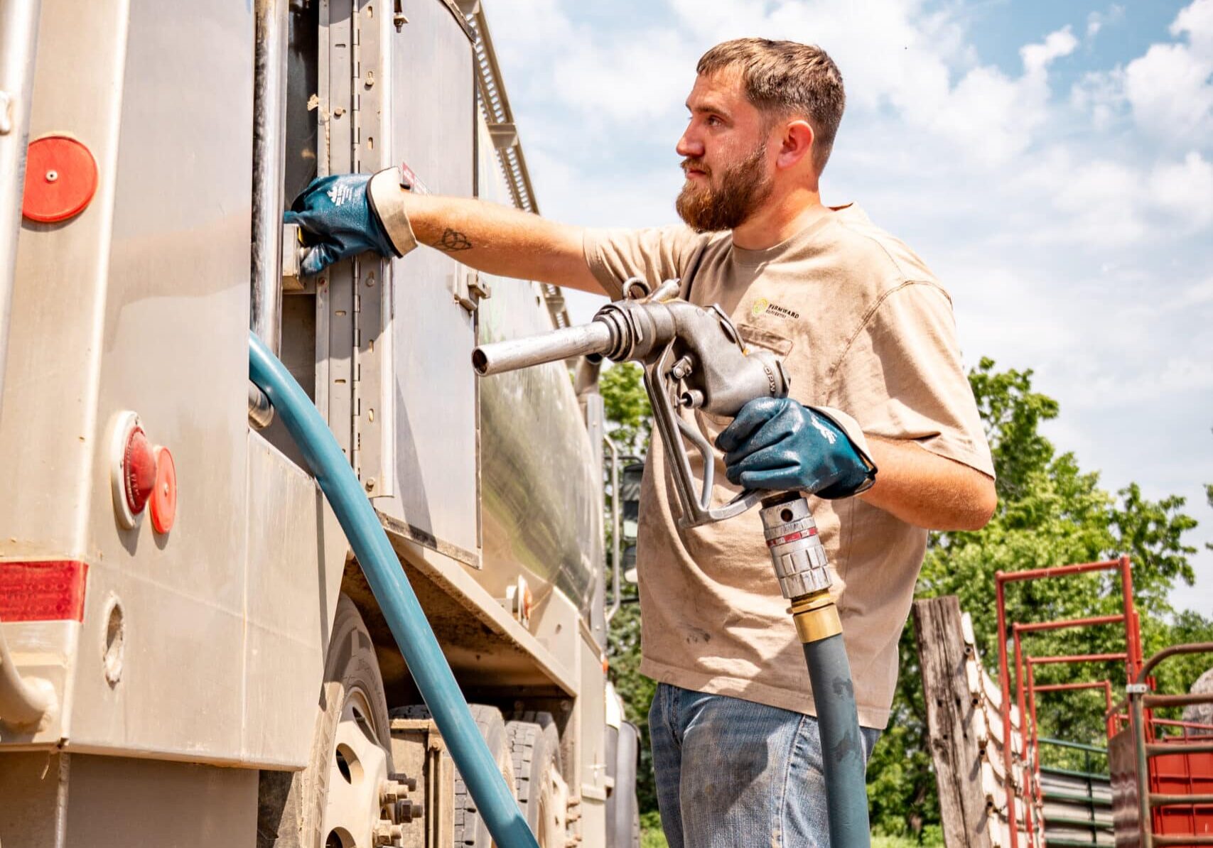 Farmward Employee working with a fuel semi