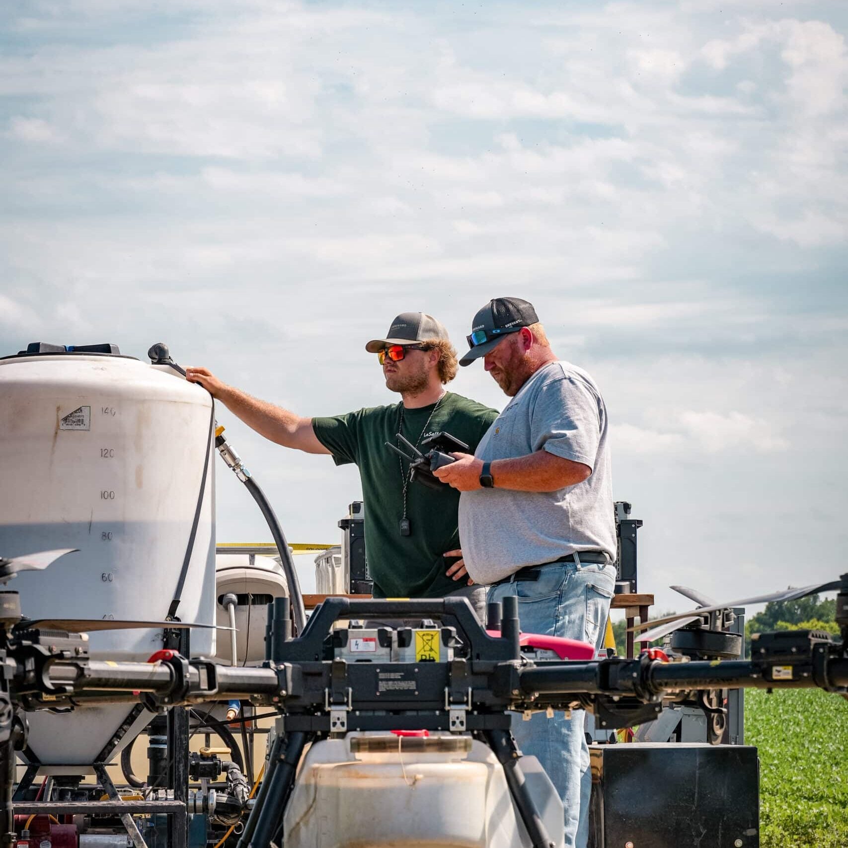 farmward agronomists with sprayer drone