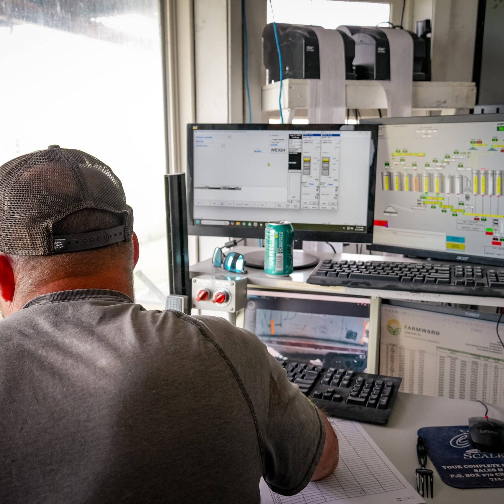 employee working on grain information