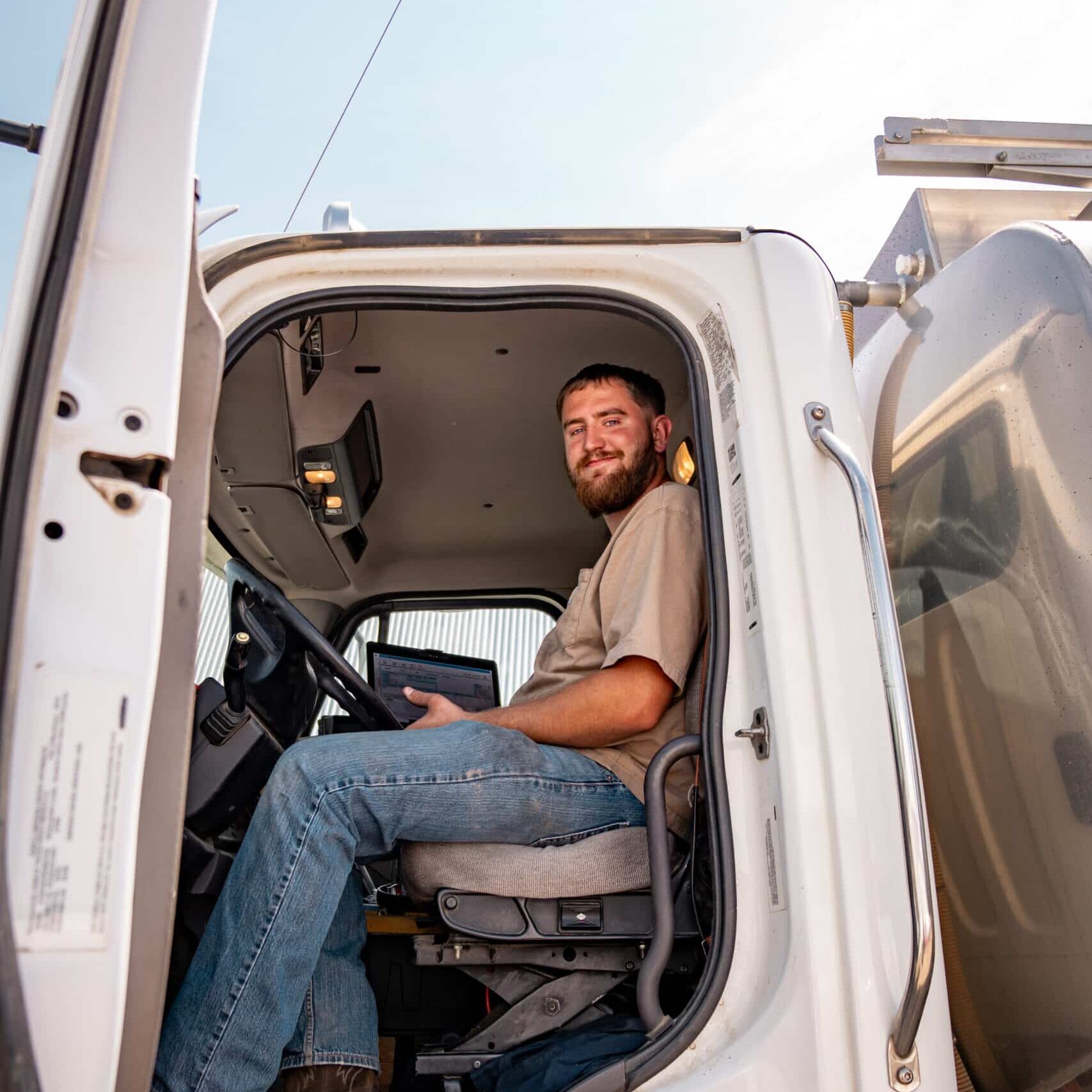 farm fuel fill employee in truck
