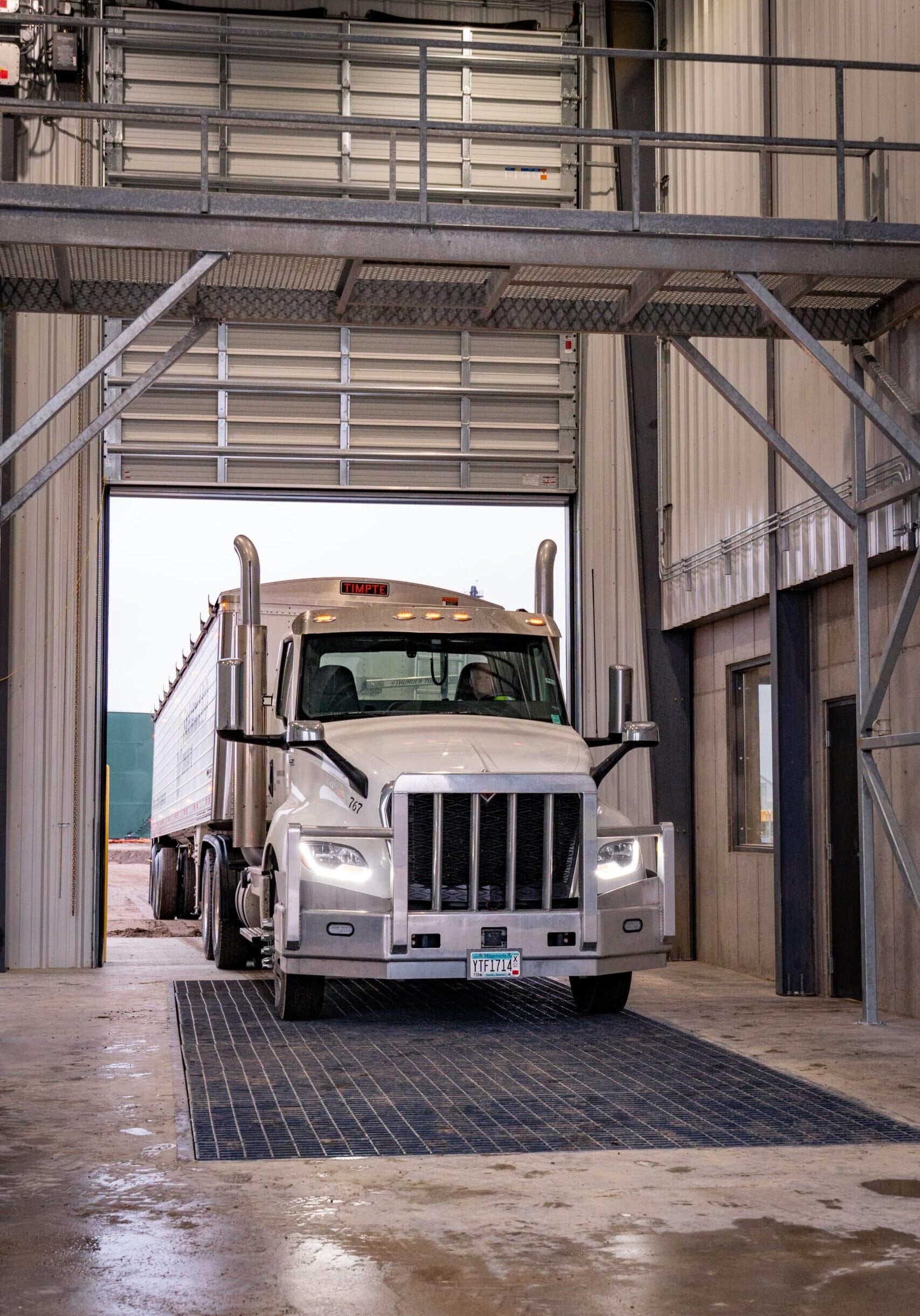 Semi pulling fuel truck into elevator