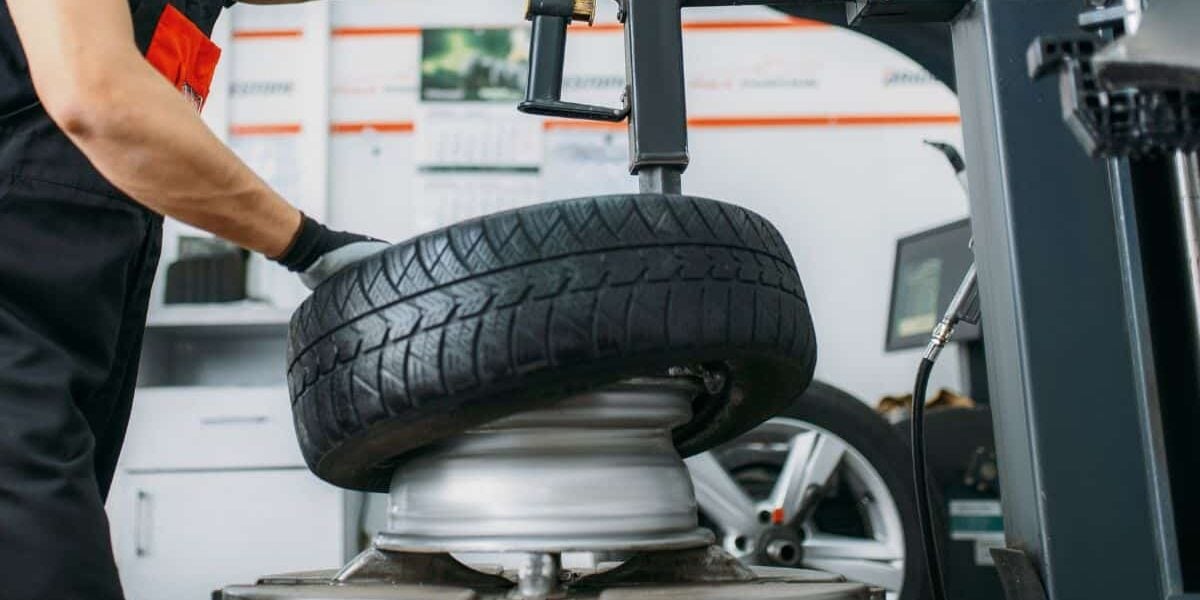 Mechanic repairing truck tire