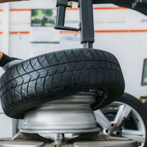 Mechanic repairing truck tire