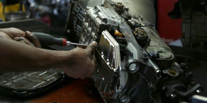 Mechanic working on transmission