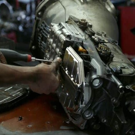 Mechanic working on transmission